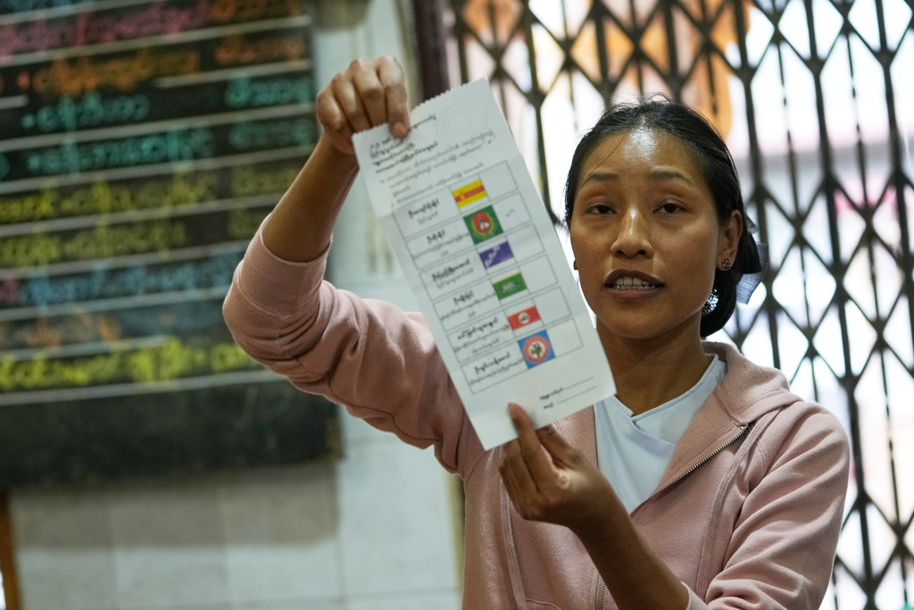 An official of the Union Election Commission counts ballots at a polling station during the second phase of general election in Mandalay, central Myanmar, Sunday, Jan. 11, 2026. (AP Photo/Aung Shine Oo)