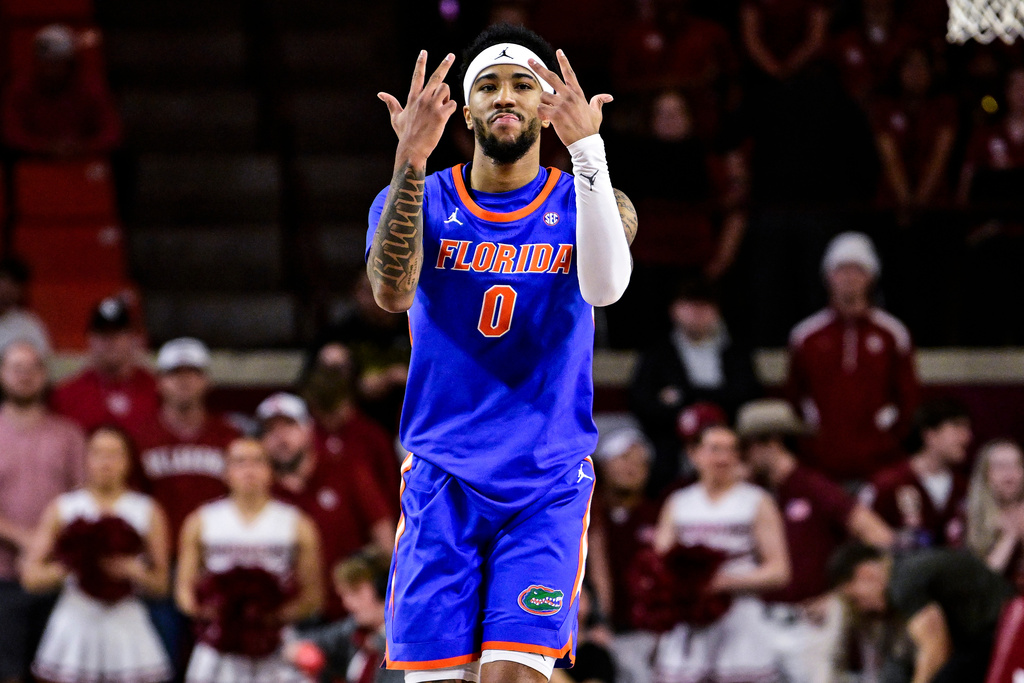 Florida guard Boogie Fland (0) gestures against Oklahoma during the first half of an NCAA college basketball game, Tuesday, Jan. 13, 2026, in Norman, Okla. (AP Photo/Gerald Leong)