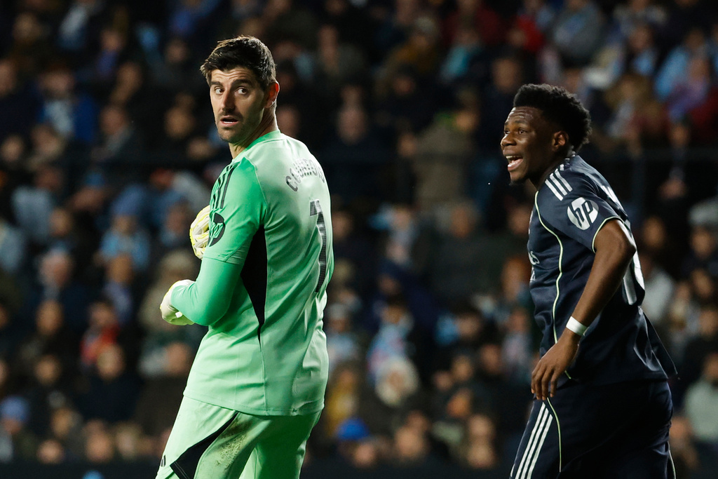 Real Madrid's goalkeeper Thibaut Courtois, left, and Real Madrid's Aurelien Tchouameni react during a Spanish La Liga soccer match between Celta Vigo and Real Madrid in Vigo, Spain, Friday, March 6, 2026. (AP Photo/Lalo R. Villar)