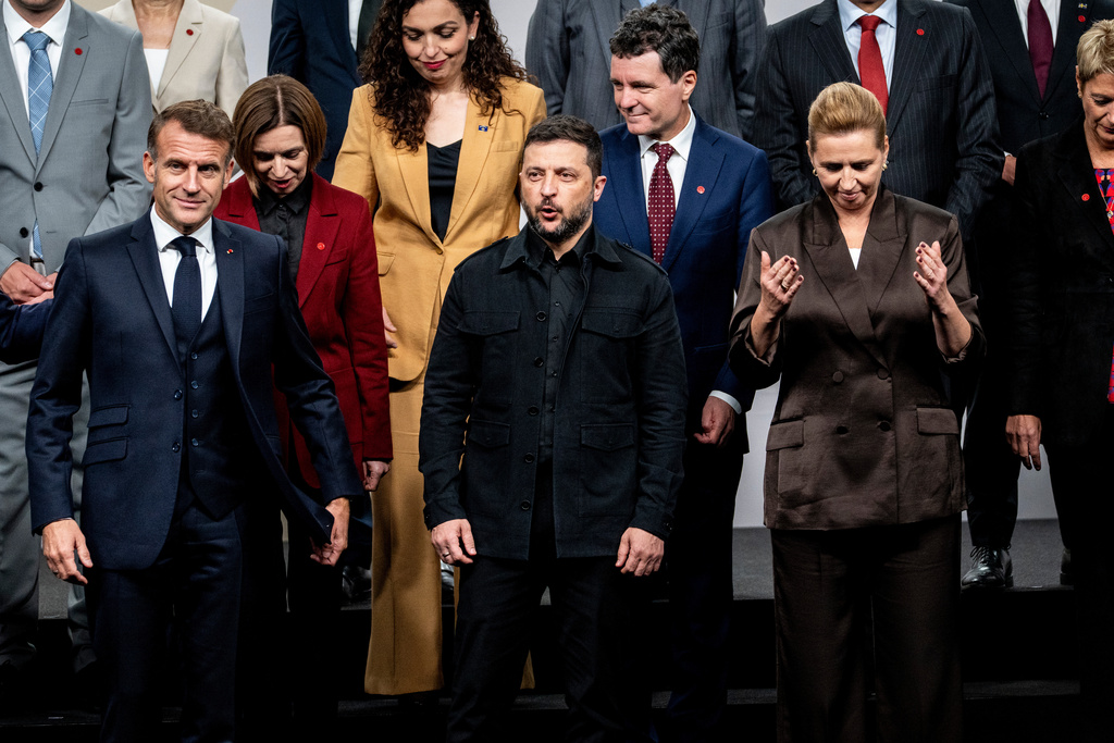Front from left, France's President Emmanuel Macron, Ukraine's President Volodymyr Zelenskyy and Danish Prime Minister Mette Frederiksen leave after a family photo during a meeting of the European Political Community (EPC) in Copenhagen, Denmark, Thursday, Oct. 2, 2025. (Ida Marie Odgaard/Ritzau Scanpix via AP)