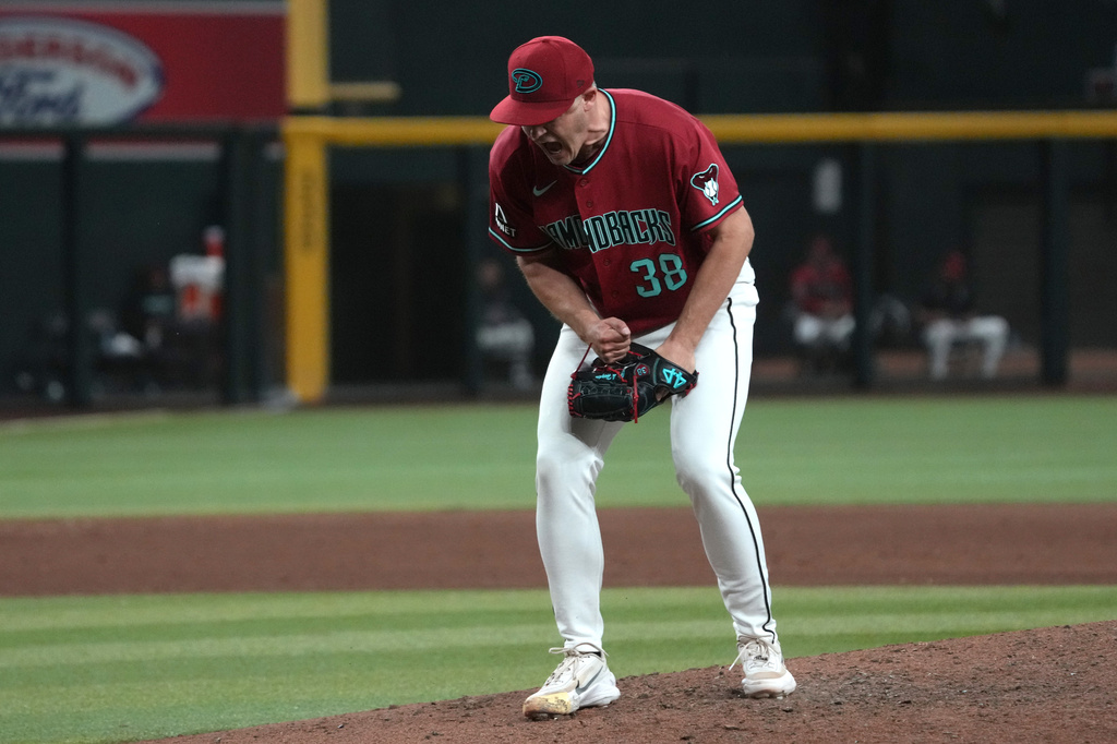 Arizona Diamondbacks pitcher Paul Sewald celebrates after defeating the Colorado Rockies during a baseball game, Saturday, May 23, 2026, in Phoenix. (AP Photo/Rick Scuteri)