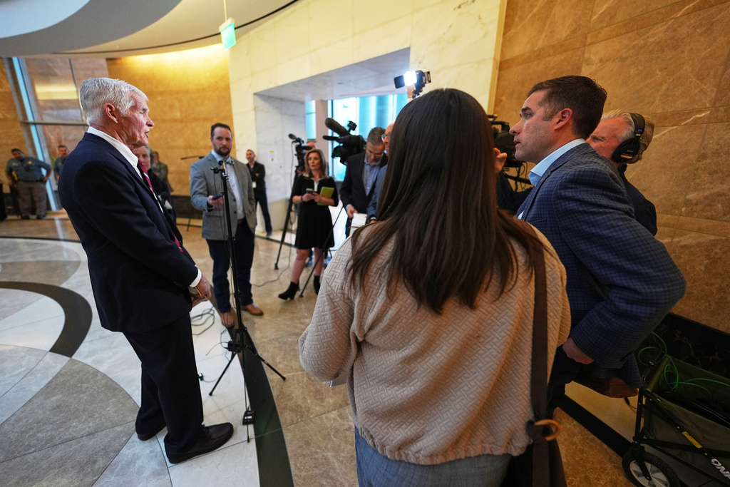 Attorney John Case, left, talks to reporters after a hearing to urge a state appeals court to overturn the convictions against former Colorado elections clerk and Donald Trump ally Tina Peters for orchestrating a data breach of her county's elections equipment Wednesday, Jan. 14, 2026, in Denver. (AP Photo/David Zalubowski)