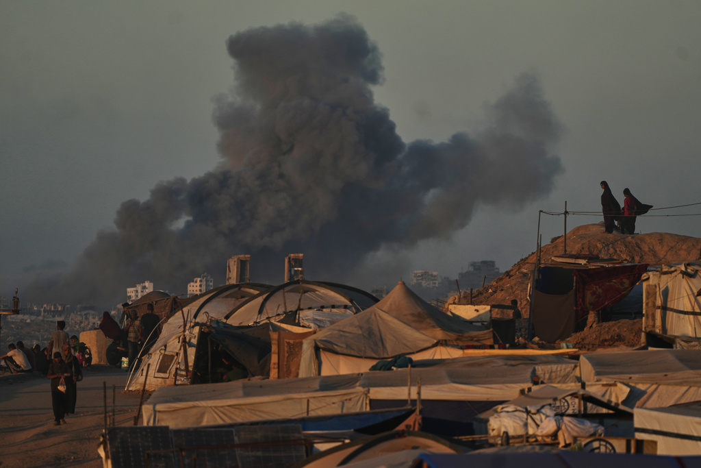 Smoke rises following an Israeli military strike in Gaza City, as seen from the central Gaza Strip, Wednesday, Oct, 1, 2025. (AP Photo/Abdel Kareem Hana)