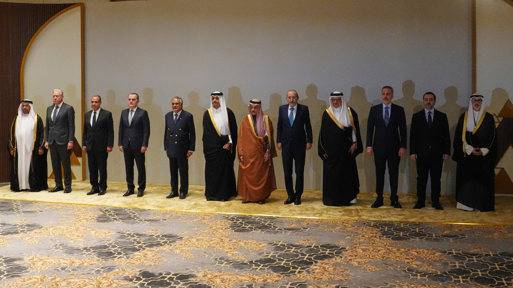 Saudi Arabia's Foreign Minister Prince Faisal bin Farhan Al-Saud, center, poses with foreign ministers before a consultative meeting of foreign ministers from a group of Arab and Islamic countries in the Saudi capital, Riyadh, Thursday, March 19, 2026. (AP Photo/Baraa Anwer)