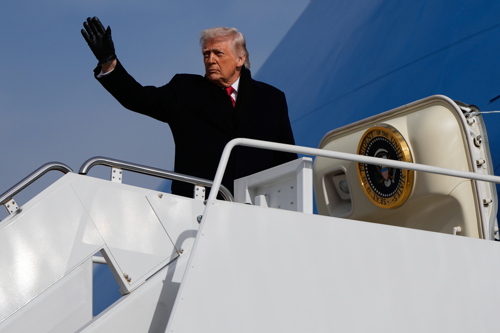 President Donald Trump boards Air Force One, Friday, Jan. 16, 2026, at Joint Base Andrews, Md. (AP Photo/Julia Demaree Nikhinson)