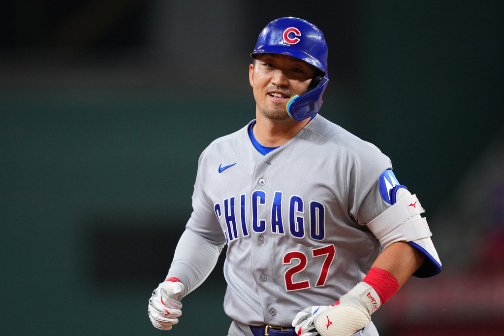 Chicago Cubs' Seiya Suzuki runs the bases after hitting a two-run home run off Texas Rangers starting pitcher Kumar Rocker during the fourth inning of a baseball game Friday, May 8, 2026, in Arlington, Texas. (AP Photo/Julio Cortez)