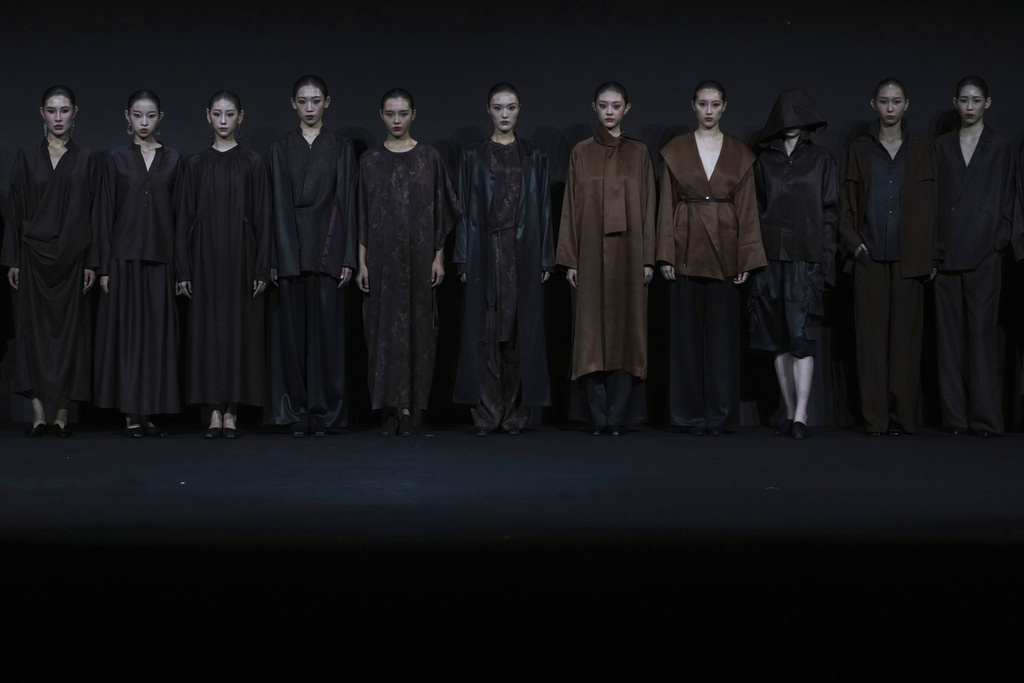 Models stand in line after presenting a latest creations by Qixiangjin during the SS2026 China Fashion Week, in Beijing, Monday, Sept. 8, 2025. (AP Photo/Andy Wong)