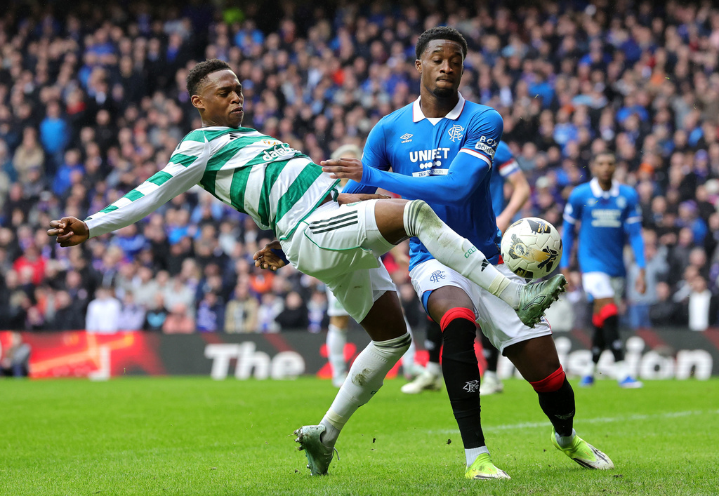 Ranger's Emmanuel Fernandez, right, and Celtic's Chukwubuike Adamu, left, challenge for the ball during the Scottish Premiership match between Glasgow Rangers and Celtic Glasgow in Glasgow, Scotland, Sunday, March 1, 2026. (Steve Welsh/PA via AP)