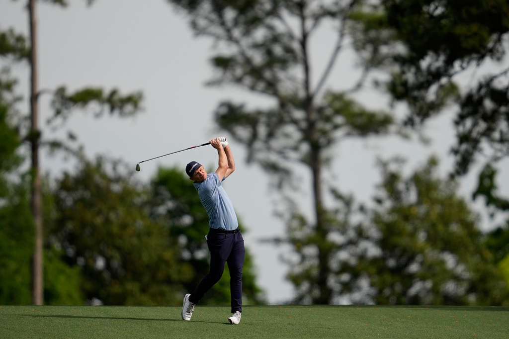 Justin Rose, of England, hits from the fairway on the second hole during a practice round at of the Masters golf tournament at the Augusta National Golf Club, Monday, April 6, 2026, in Augusta, Ga. (AP Photo/Ashley Landis)