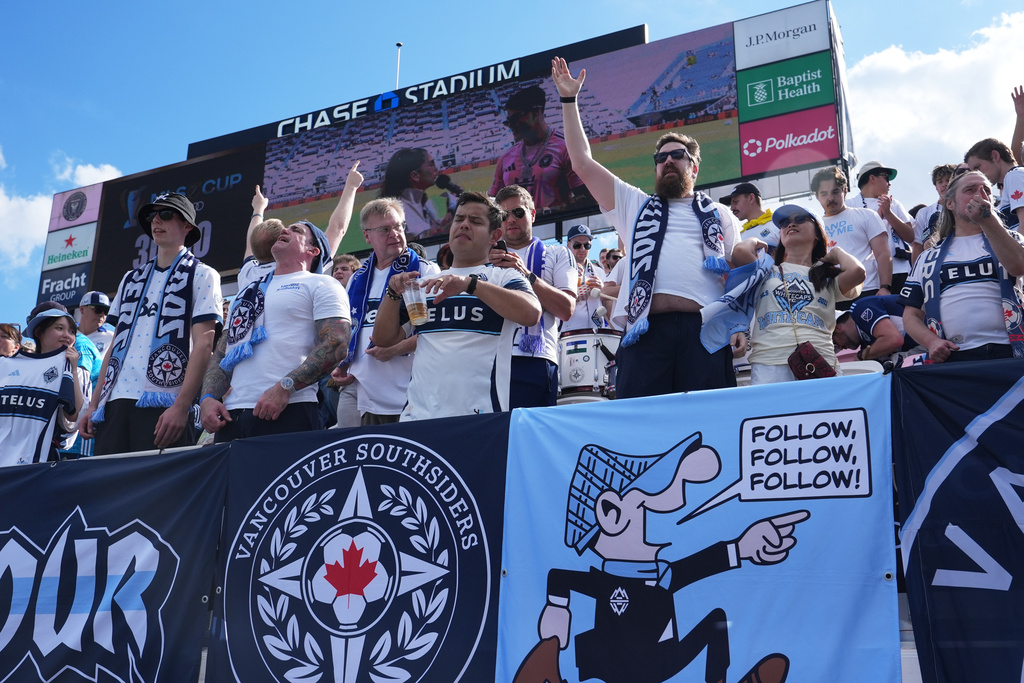 Vancouver Whitecaps fans cheer before the MLS Cup final soccer match against the Inter Miami, Saturday, Dec. 6, 2025, in Fort Lauderdale, Fla. (AP Photo/Lynne Sladky)