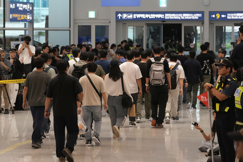 South Korean workers released after days of detention in Georgia arrive at the Incheon International Airport, in Incheon, South Korea, Friday, Sept. 12, 2025. (AP Photo/Ahn Young-joon)
