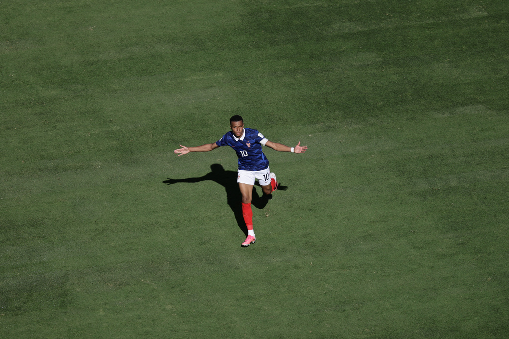 France's Kylian Mbappe celebrates after scoring third goal during the World Cup Group I soccer match between France and Senegal in East Rutherford, N.J., near New York, Tuesday, June 16, 2026. (AP Photo/Adam Hunger)