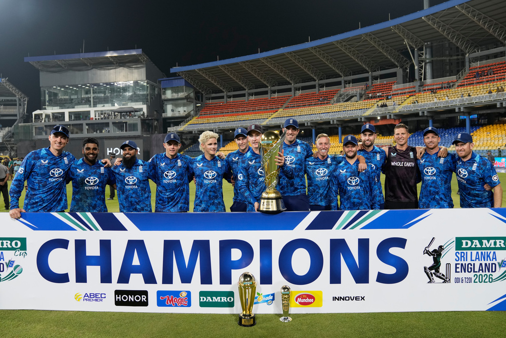 England's team members pose with the trophy following their win over Sri Lanka in the third ODI cricket match between England and Sri Lanka in Colombo, Sri Lanka, Tuesday, Jan. 27, 2026. (AP Photo/Eranga Jayawardena)