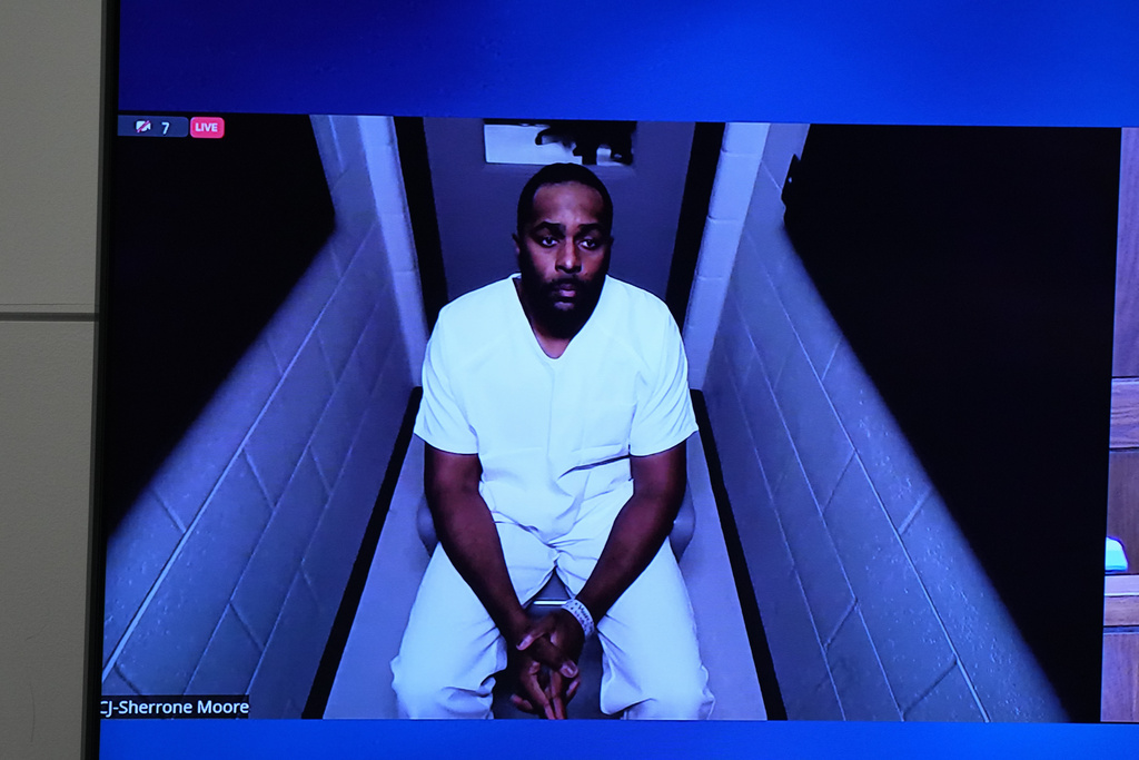 Michigan football coach Sherrone Moore appears via video in court on Friday, Dec. 12, 2025 in Ann Arbor, Mich. (AP Photo/ Ryan Sun)\