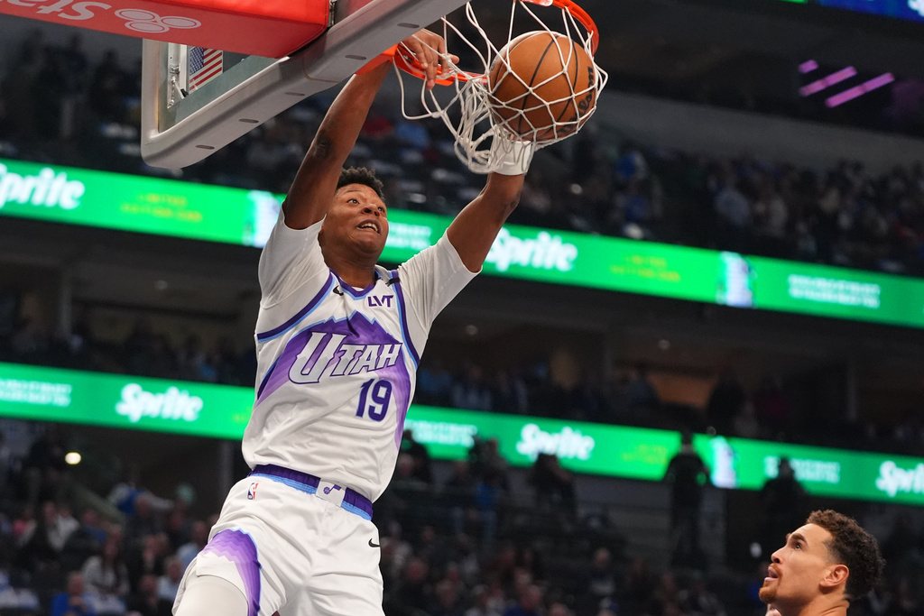 Utah Jazz guard Ace Bailey slam dunks during the first half of an NBA basketball game against the Dallas Mavericks in Dallas, Thursday, Jan. 15, 2026. (AP Photo/LM Otero)