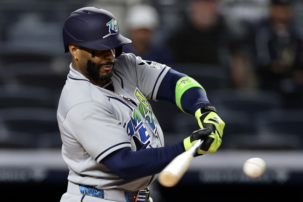 Tampa Bay Rays designated hitter Yandy Díaz hits a two-run scoring single in the ninth inning during the second baseball game of a doubleheader against the New York Yankees, Tuesday, Sept. 22, 2026, in New York. (AP Photo/Adam Hunger)