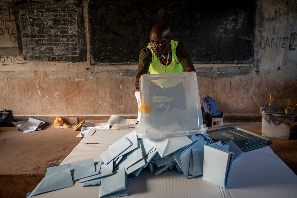 FILE - Electoral workers start to count votes at the Lycée Boganda polling station in the capital Bangui, Central African Republic Sunday, Dec. 27, 2020. (AP Photo/File)