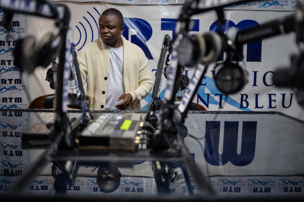 Verité Johnson works at a community radio station, providing daily awareness and updates on Ebola in Bunia, Congo, Thursday, June 4, 2026. (AP Photo/Moses Sawasawa)