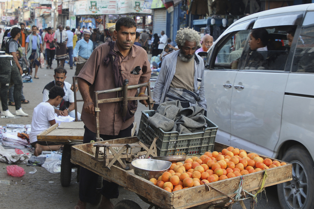A street vender rides his cart at along a street in Aden, Yemen, Friday, Dec. 26, 2025. (AP Photo)