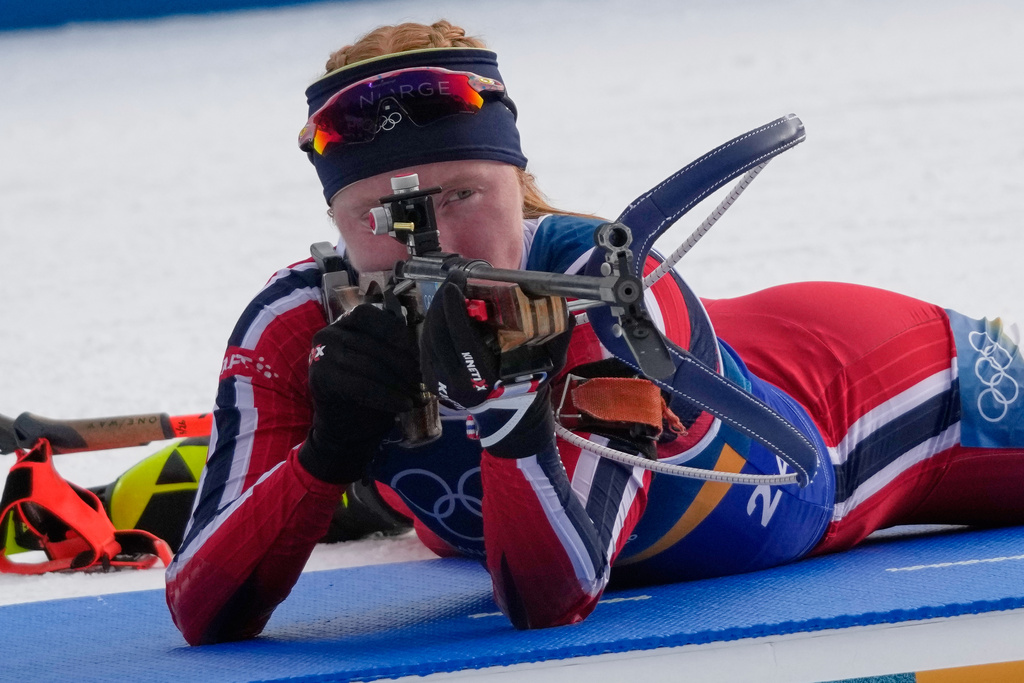 Norway's Maren Kirkeeide shoots during the women's biathlon 4 x 6-kilometers relay race at the 2026 Winter Olympics, in Anterselva, Italy, Wednesday, Feb. 18, 2026. (AP Photo/David J. Phillip)