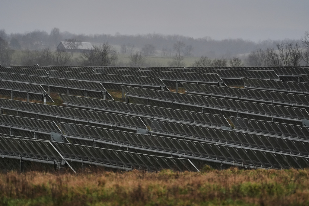 Solar panels operate Wednesday, Jan. 14, 2026, at a farm in Lancaster, Ky. (AP Photo/Joshua A. Bickel)