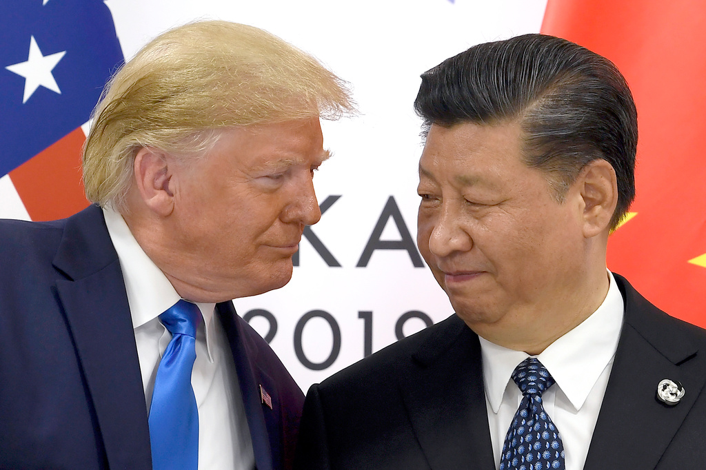 FILE - President Donald Trump, left, meets with Chinese President Xi Jinping during a meeting on the sidelines of the G-20 summit in Osaka, Japan, June 29, 2019. (AP Photo/Susan Walsh, File)