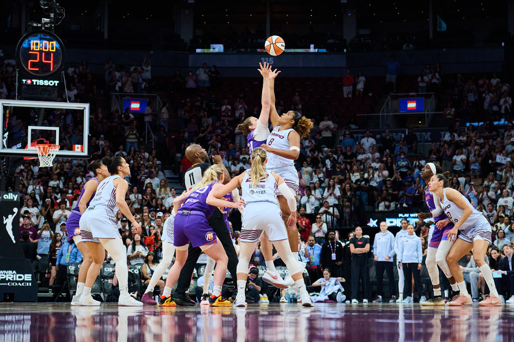 Toronto Tempo's Nyara Sabally (8) and Phoenix Mercury's Kyara Linskens (31) jump for the ball at the start of first half of an WNBA basketball game in Toronto, on Saturday, June 27, 2026. (Sammy Kogan /The Canadian Press via AP)