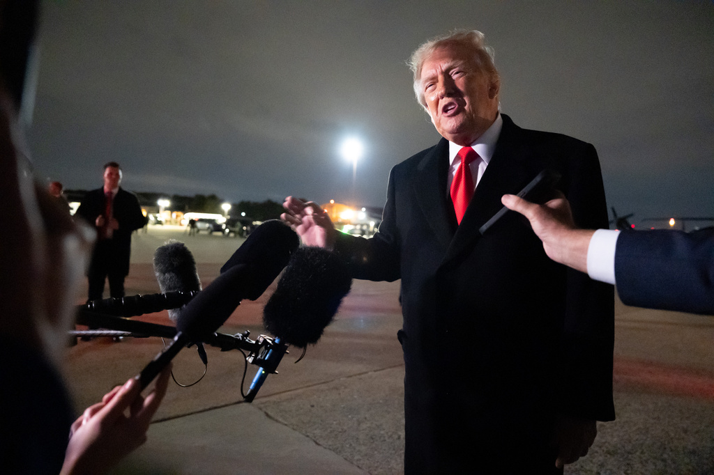 President Donald Trump speaks with reporters as he arrives on Air Force One, Saturday, Oct. 10, 2026, at Joint Base Andrews, Md. (AP Photo/Alex Brandon)
