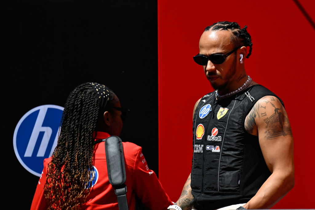 Ferrari driver Lewis Hamilton of Britain walks through the ahead of the Austrian F1 Grand Prix, in Spielberg, Austria, Thursday, June 25, 2026. (AP Photo/Denes Erdos)