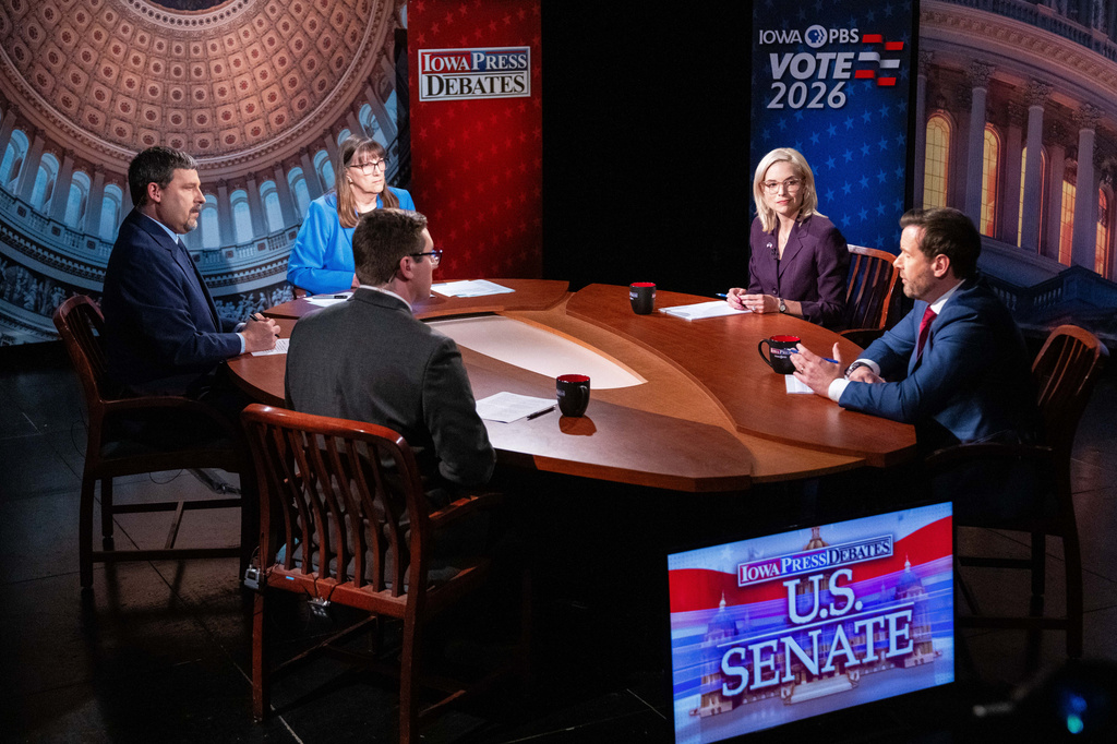 U.S. Senate candidates Rep. Ashley Hinson, R-Iowa, and Rep. Josh Turek, D-Council Bluffs, take questions during a debate Wednesday, Oct. 7, 2026, in Johnston, Iowa. (Cody Scanlan/The Des Moines Register via AP, Pool)