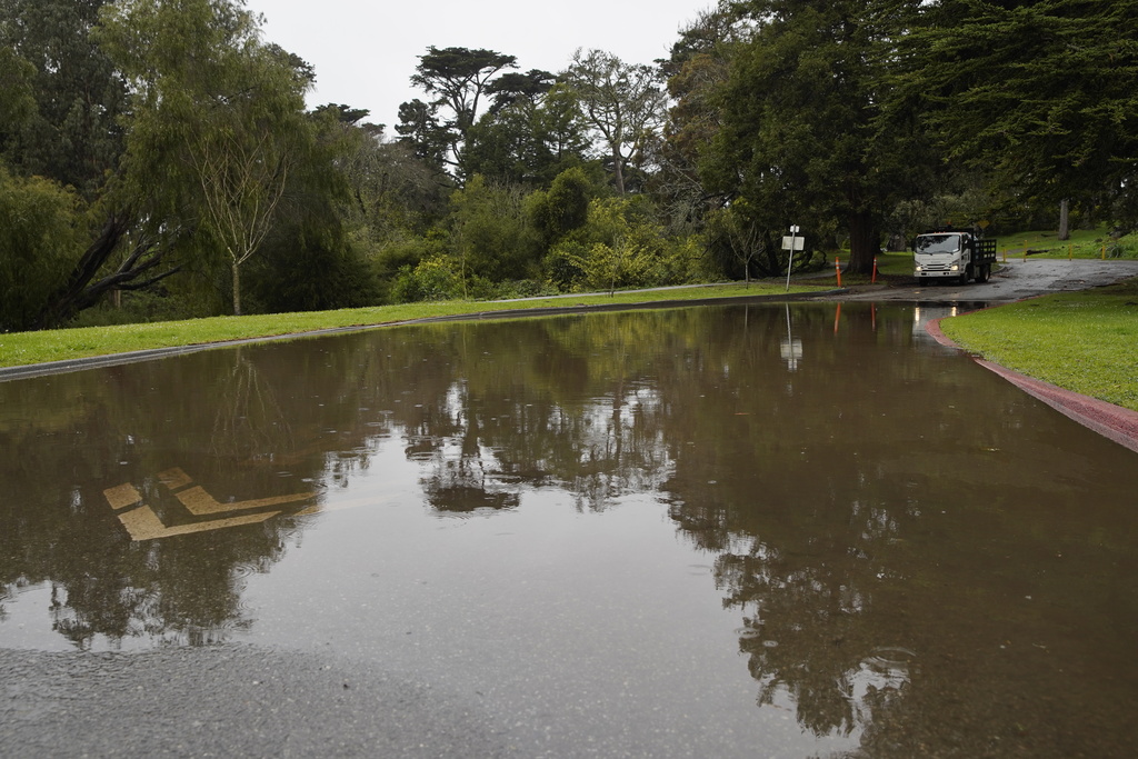 Rain fall floods a street in Golden Gate Park, in San Francisco, Tuesday, Feb. 17, 2026. (Giselle Garza Lerma/San Francisco Chronicle via AP)
