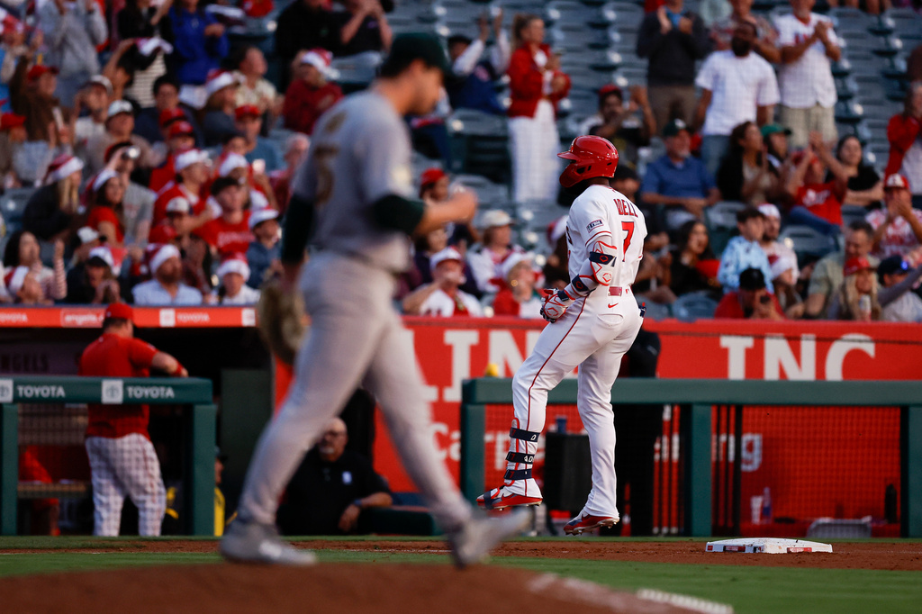Los Angeles Angels' Jo Adell (7) rounds the bases after hitting a two-run home run during the fifth inning of a baseball game against the Athletics, Friday, June 26, 2026, in Anaheim, Calif. (AP Photo/Caroline Brehman)