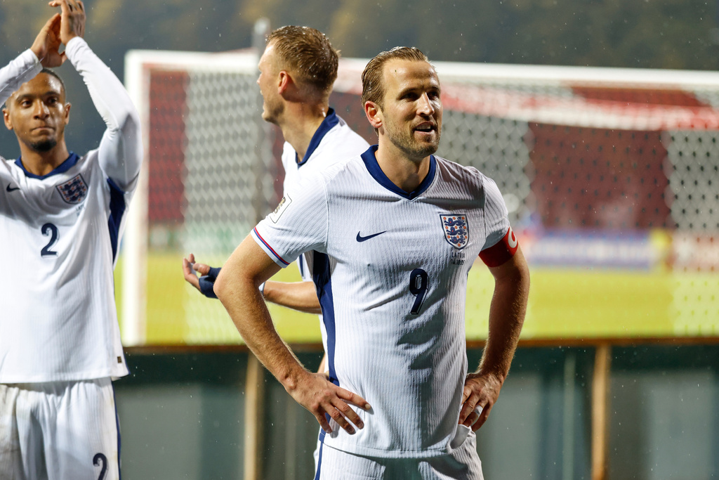 England's Harry Kane greets England's travelling support after the 2026 World Cup group K qualifying soccer match between Latvia and England in Riga, Latvia, Tuesday, Oct. 14, 2025. (AP Photo/Mindaugas Kulbis)