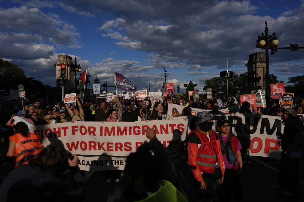 People march during Illinois Coalition for Immigrant & Refugee Rights' "Chicago Says No Trump No Troops" protest Saturday, Sept. 6, 2025, in Chicago. (AP Photo/Carolyn Kaster)
