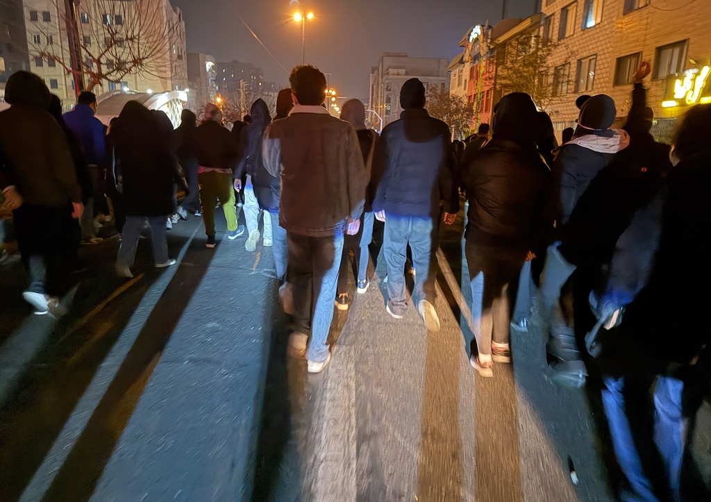 In this photo obtained by The Associated Press, Iranians attend an anti-government protest in Tehran, Iran, Thursday, Jan. 8, 2026. (UGC via AP)