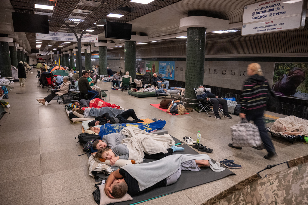 People take shelter in a metro station during a night Russian attack, in Kyiv, Ukraine, early Thursday, Aug. 20, 2026. (AP Photo/Danylo Antoniuk)