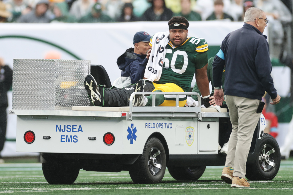 Green Bay Packers guard Zach Bako-Bewele (50) is taken off the field following an injury during an NFL football game against the New York Jets in East Rutherford, N.J., Sunday, Sept. 20, 2026. (AP Photo/Adam Hunger)