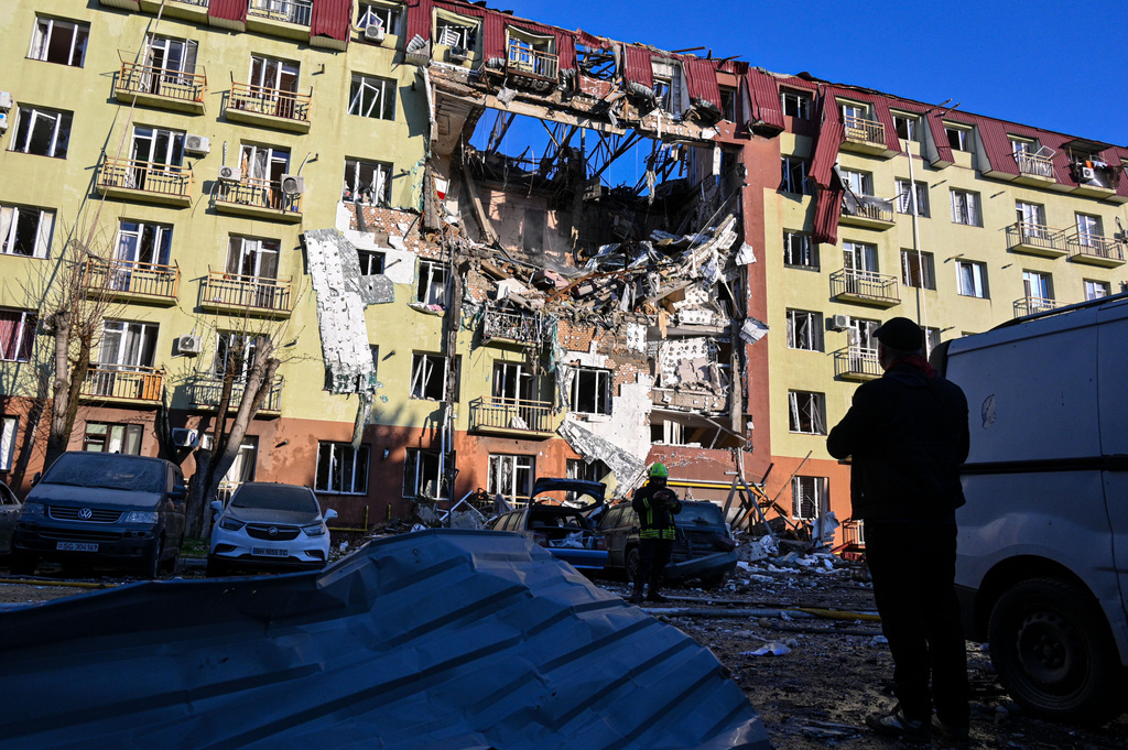 A rescue worker walks in front of residential building which was heavily damaged after a Russian strike in Odesa, Ukraine, Monday, April 6, 2026. (AP Photo/Michael Shtekel)