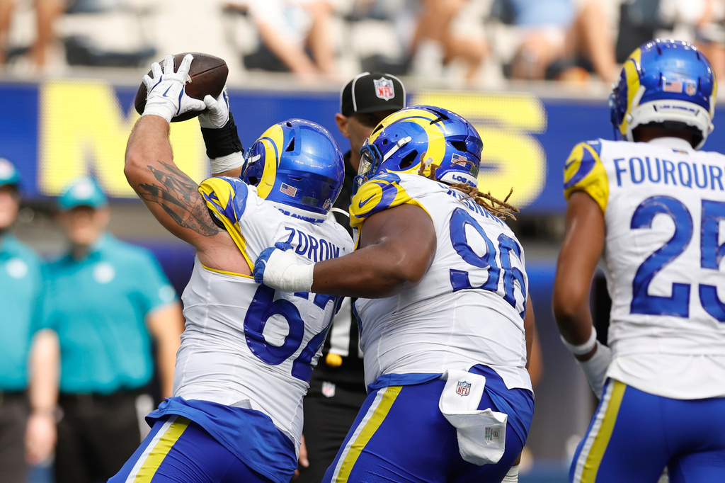 Los Angeles Rams defensive lineman Payton Zdroik (62) recovers a fumble during the second half an NFL preseason football game against the New Orleans Saints Saturday, Aug. 22, 2026, in Inglewood, Calif. (AP Photo/Caroline Brehman )