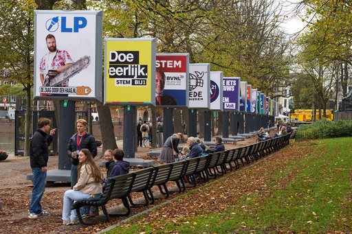 People enjoy the autumn weather next to some of the election billboards of 26 of the 27 political parties participating in the Oct. 29 general elections in The Hague, Netherlands, Wednesday, Oct. 22, 2025. (AP Photo/Peter Dejong) People enjoy the autumn weather next to some of the election billboards of 26 of the 27 political parties participating in the Oct. 29 general elections in The Hague, Netherlands, Wednesday, Oct. 22, 2025. (AP Photo/Peter Dejong)