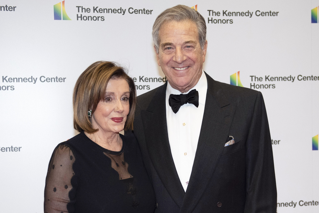 FILE - Speaker of the House Nancy Pelosi, D-Calif., and her husband, Paul Pelosi, arrive at the State Department for the Kennedy Center Honors State Department Dinner, on Dec. 7, 2019, in Washington. (AP Photo/Kevin Wolf, File)