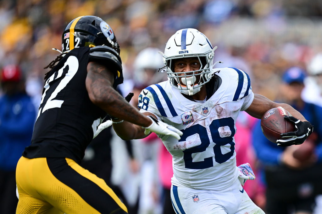 Indianapolis Colts running back Jonathan Taylor (28) pushes off Pittsburgh Steelers cornerback Asante Samuel Jr. (22) during the second half of an NFL football game in Pittsburgh, Sunday, Oct. 11, 2026. (AP Photo/David Dermer )