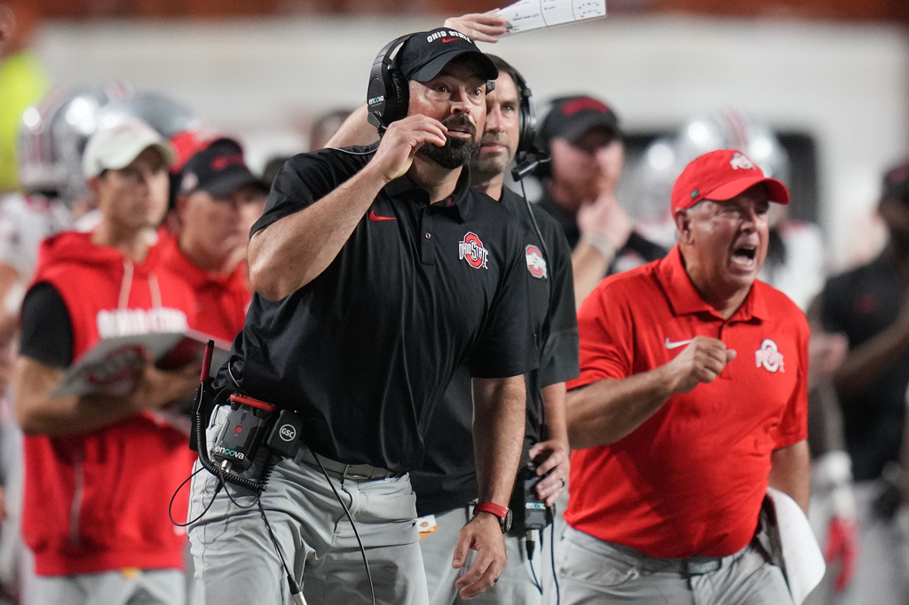 Ohio State head coach Ryan Day reacts to an Ohio State score against Texas during the first half of an NCAA college football game in Austin, Texas, Saturday, Sept. 12, 2026. (AP Photo/Eric Gay)