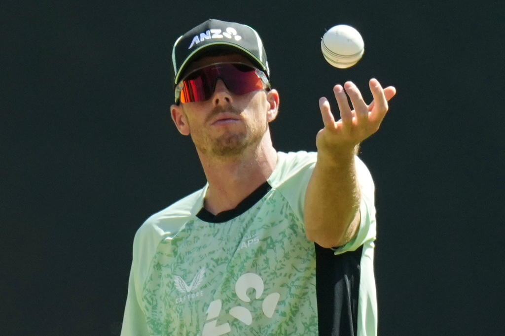 New Zealand's captain Mitchell Santner tosses a ball during a practice session ahead of the T20 World Cup cricket final match against India in Ahmedabad, India, Saturday, March 7, 2026. (AP Photo/Ajit Solanki)
