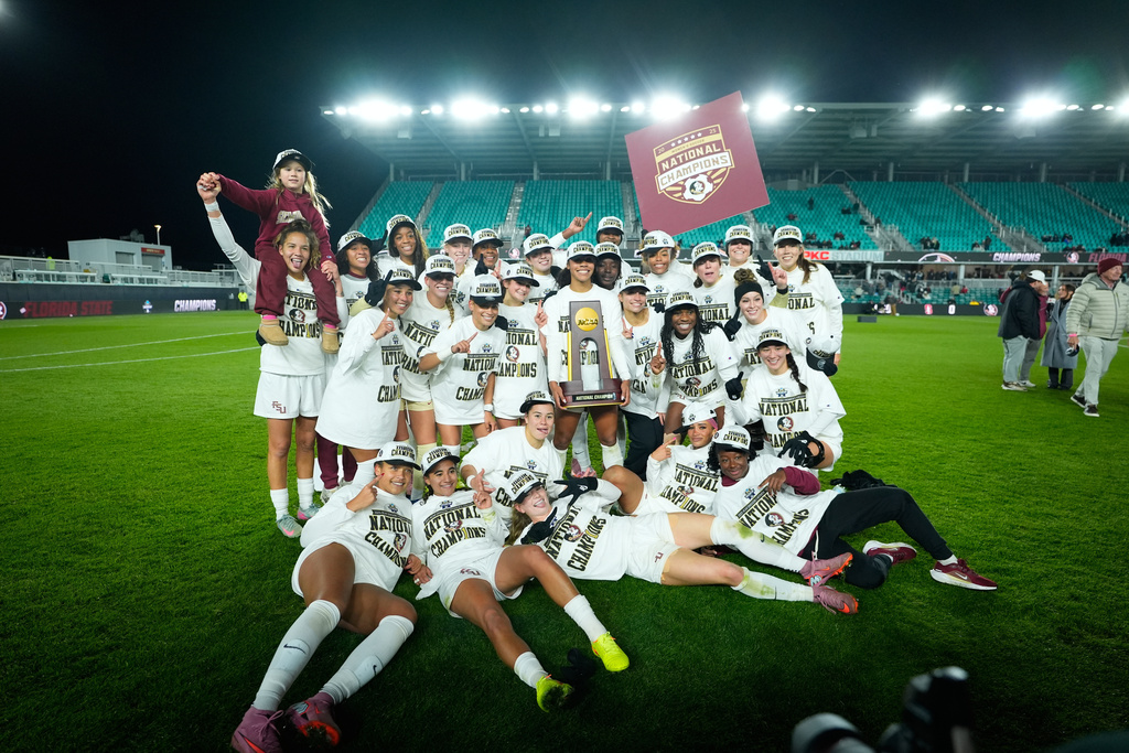 Members of Florida State celebrate after defeating Stanford in the NCAA college soccer tournament final Monday, Dec. 8, 2025, in Kansas City, Mo. (AP Photo/Charlie Riedel)