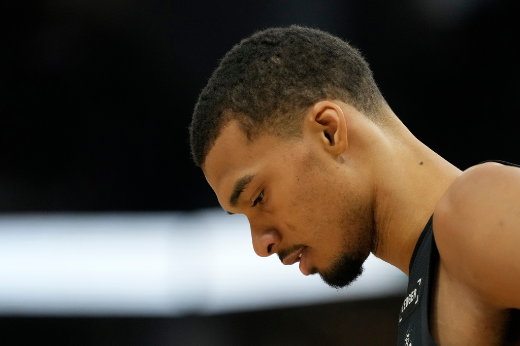 San Antonio Spurs' Victor Wembanyama looks on during the first half of an NBA basketball game against the Milwaukee Bucks, Saturday, March 28, 2026, in Milwaukee. (AP Photo/Aaron Gash)