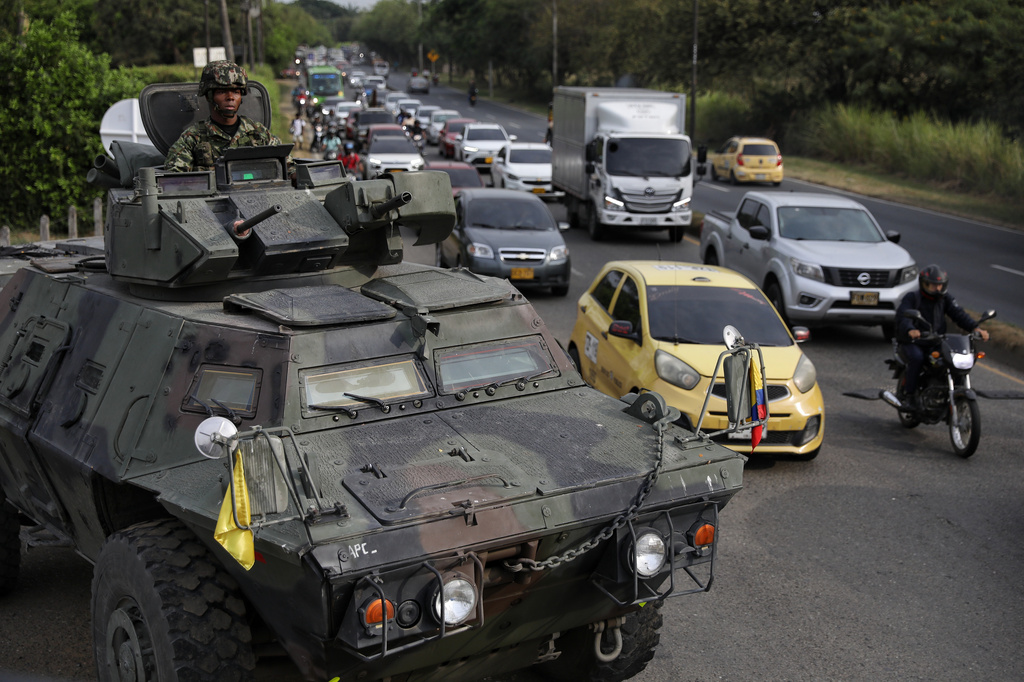 A soldier keeps watch from the turret of an armored vehicle ahead of the inauguration of President-elect Abelardo de la Espriella in Cali, Colombia, Wednesday, Aug. 5, 2026. (AP Photo/Santiago Saldarriaga)