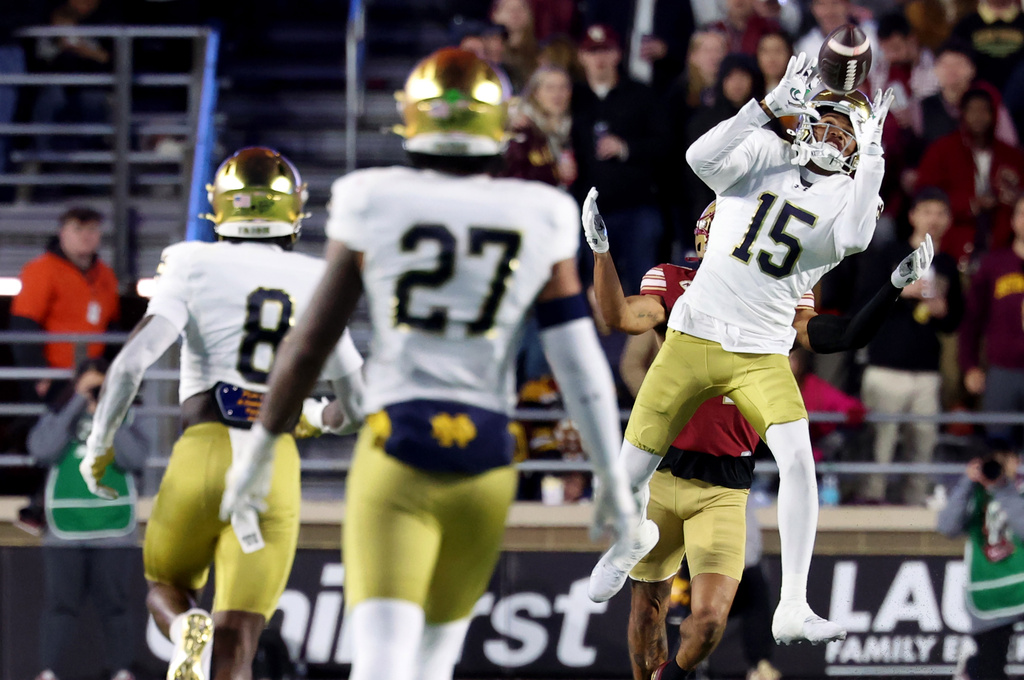 Notre Dame cornerback Leonard Moore (15) intercepts the ball during the second half of an NCAA college football game against Boston College, Saturday, Nov. 1, 2025 in Boston. (AP Photo/Mark Stockwell)