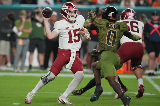 Stanford quarterback Ben Gulbranson (15) stands back to pass as Miami defensive back Kelonte Scott (0) defends during the first half of an NCAA college football game, Saturday, Oct. 25, 2025, in Miami Gardens, Fla. (AP Photo/Lynne Sladky) Stanford quarterback Ben Gulbranson (15) stands back to pass as Miami defensive back Kelonte Scott (0) defends during the first half of an NCAA college football game, Saturday, Oct. 25, 2025, in Miami Gardens, Fla. (AP Photo/Lynne Sladky)
