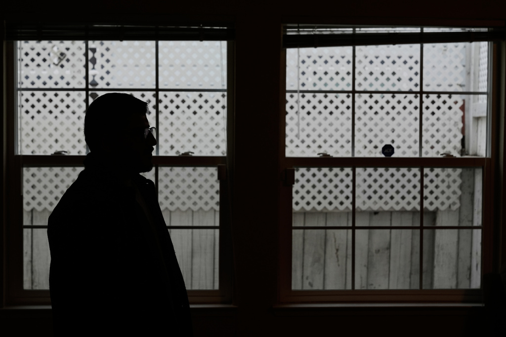 Rohullah R., who did not want his face to be shown or to disclose his last name out of fear of ICE, is photographed at his home in North Highlands, Calif., Friday, Dec. 5, 2025. (AP Photo/Godofredo A. Vásquez)